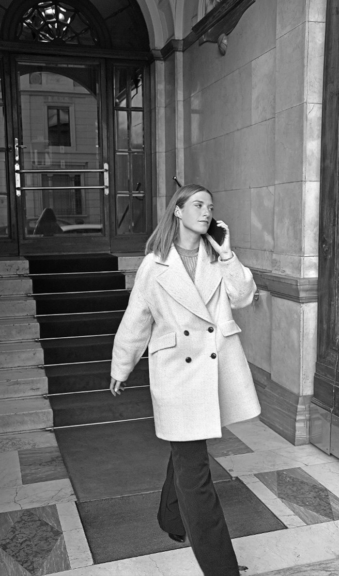 Eye On Model booker on a call outside the agency office in central Milan
